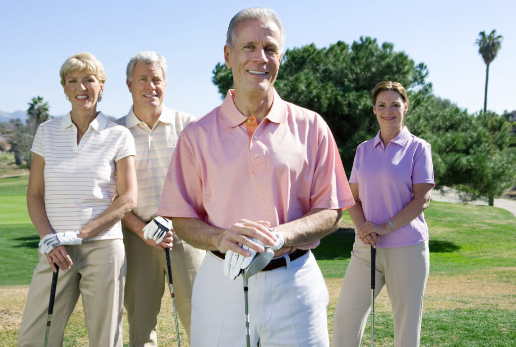 Two couples posing on golf course at Leisure Village, Camarillo